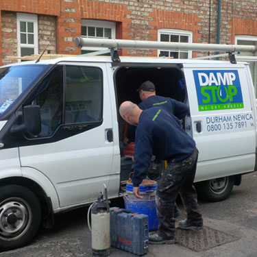 damp stop van and team